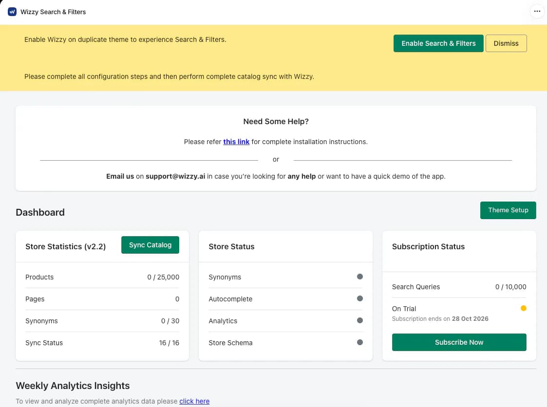 Wizzy dashboard with a banner to enable Wizzy on a duplicate theme and finish configuration before a full catalog sync, a help card with the support email, and cards for Store Statistics with 0 of 25,000 products and 0 of 30 synonyms, Store Status for synonyms, autocomplete, analytics and store schema, and Subscription Status showing 0 of 10,000 search queries on trial